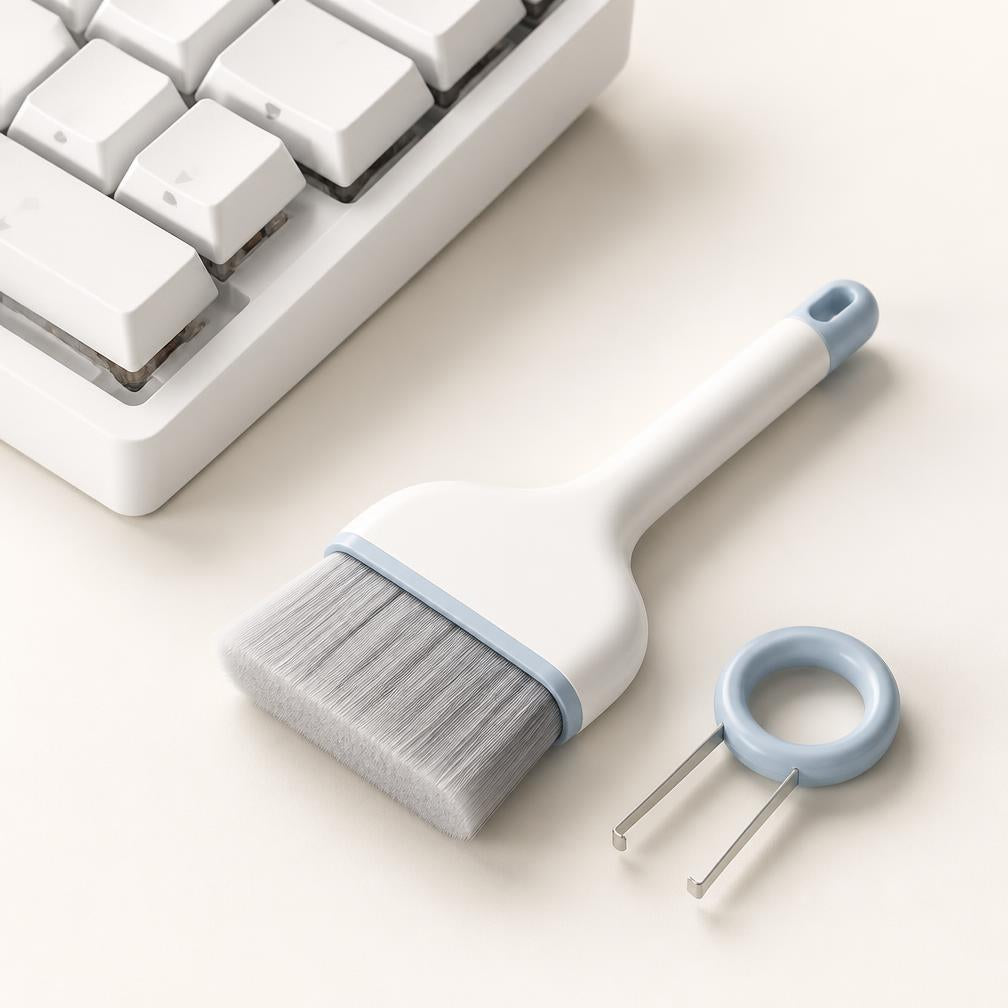 Brosse large et extracteur de touches ClairDesk près d'un clavier blanc